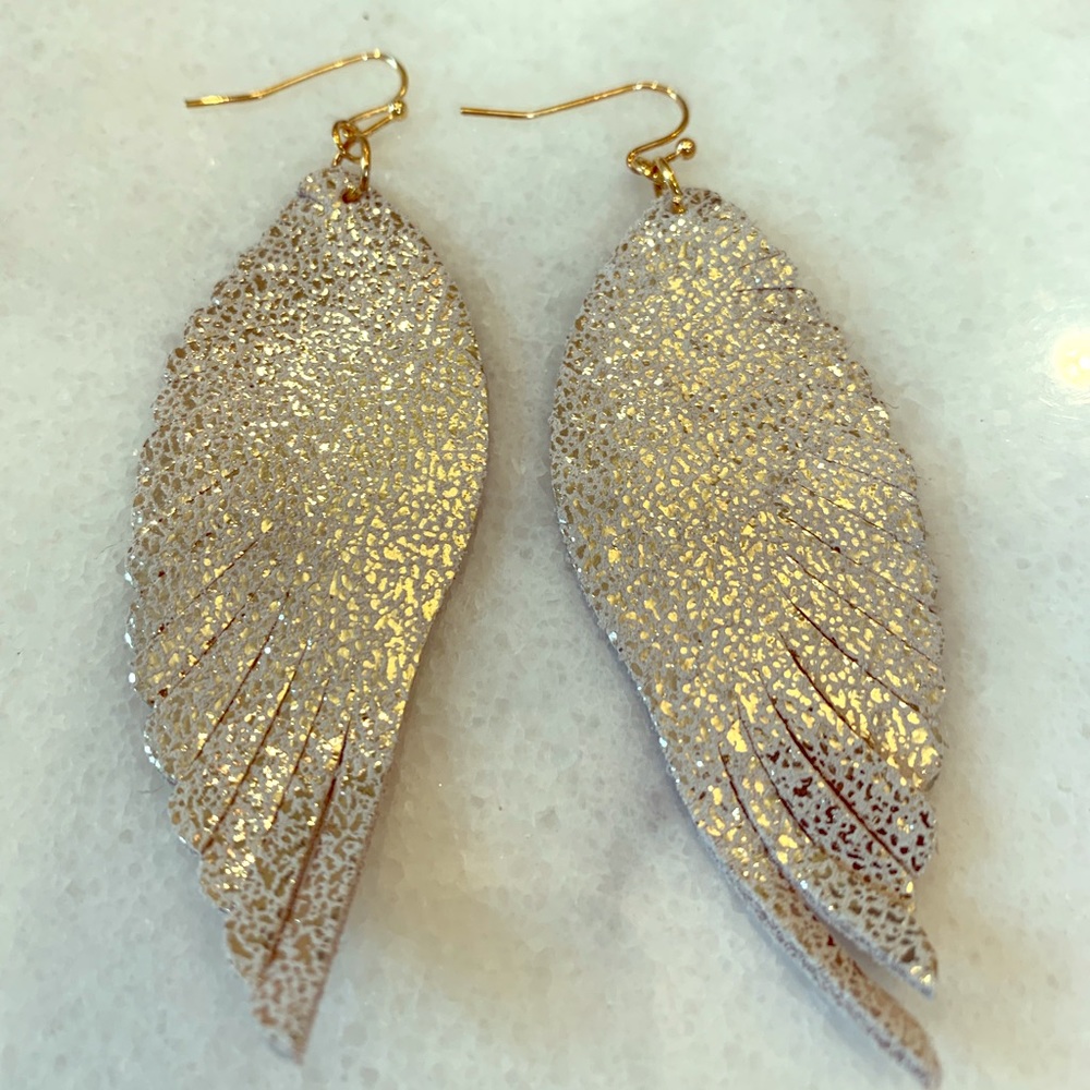 Gold and suede feather earrings